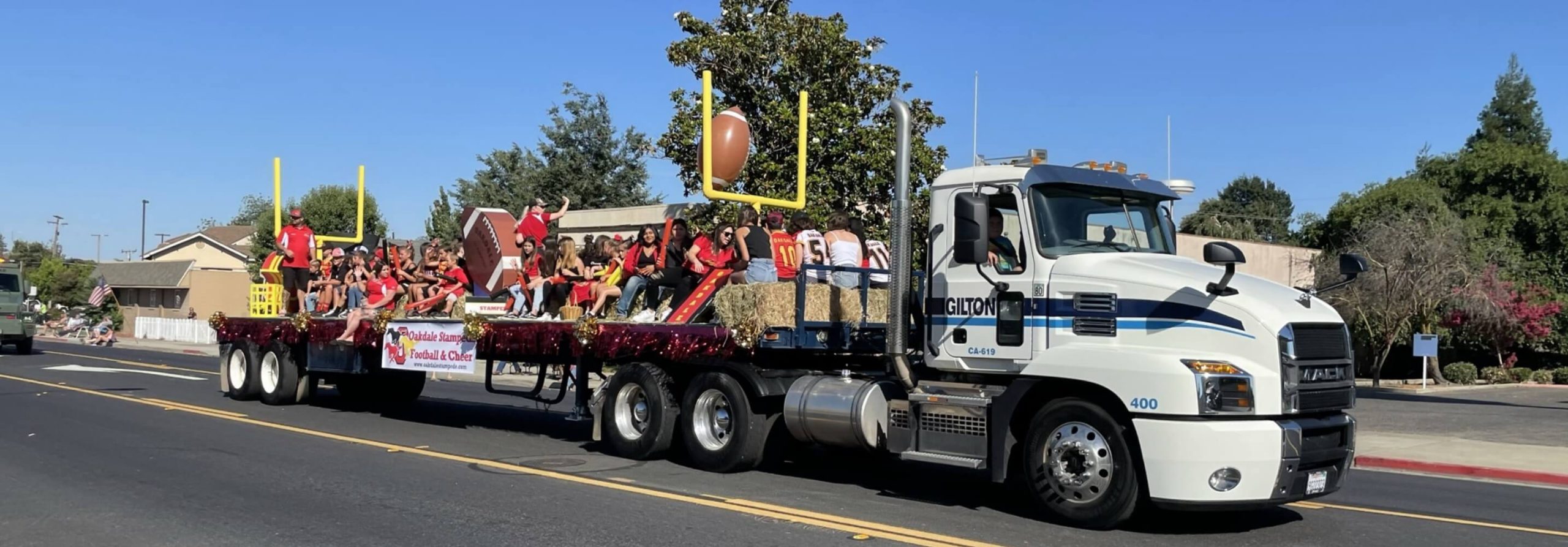 Gilton Solid Waste Management long truck in parade and cheer